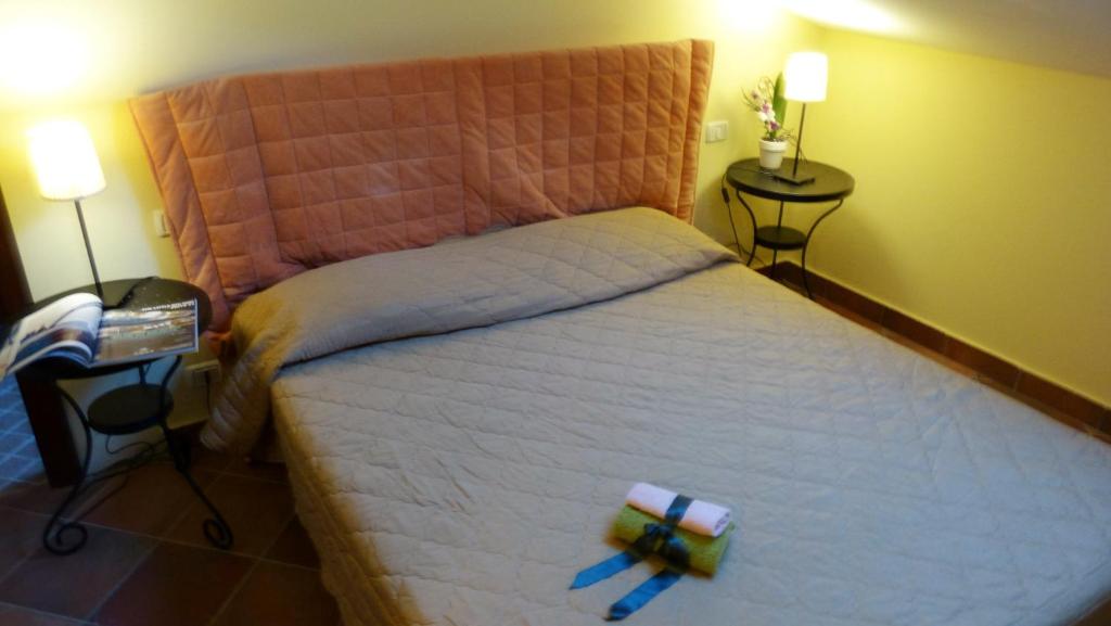 Postel nebo postele na pokoji v ubytování Appartamenti Albarosa by Holiday World