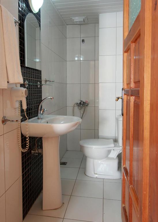 Koupelna v ubytování Baronessa Apart Hotel
