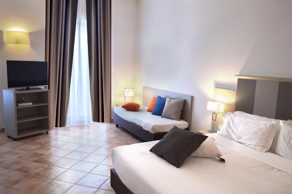 Postel nebo postele na pokoji v ubytování Hotel Gajeta