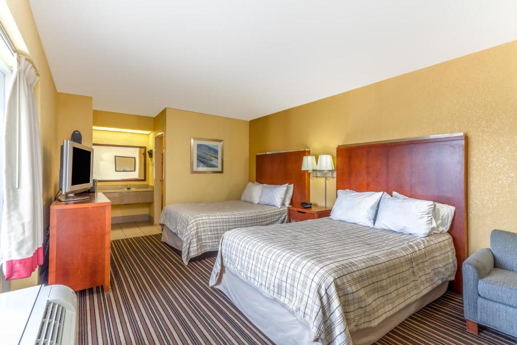 Letto o letti in una camera di Lodge at Mill Creek Pigeon Forge