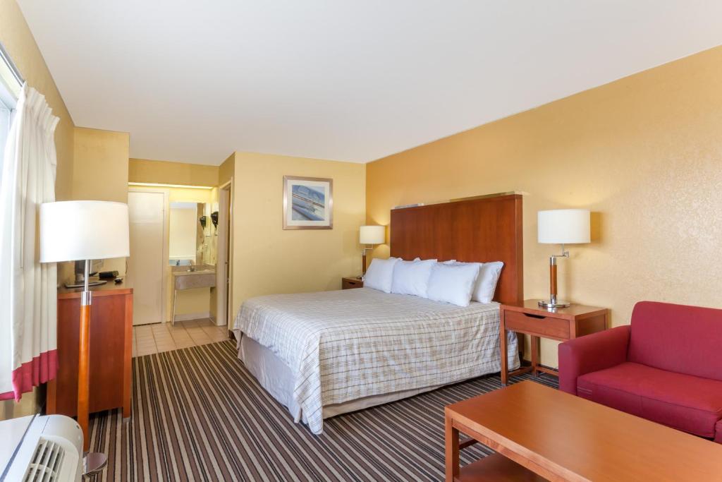 Letto o letti in una camera di Lodge at Mill Creek Pigeon Forge