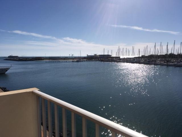 a view of a marina with a boat in the water at Appartement - Ile des pecheurs in Cap d'Agde