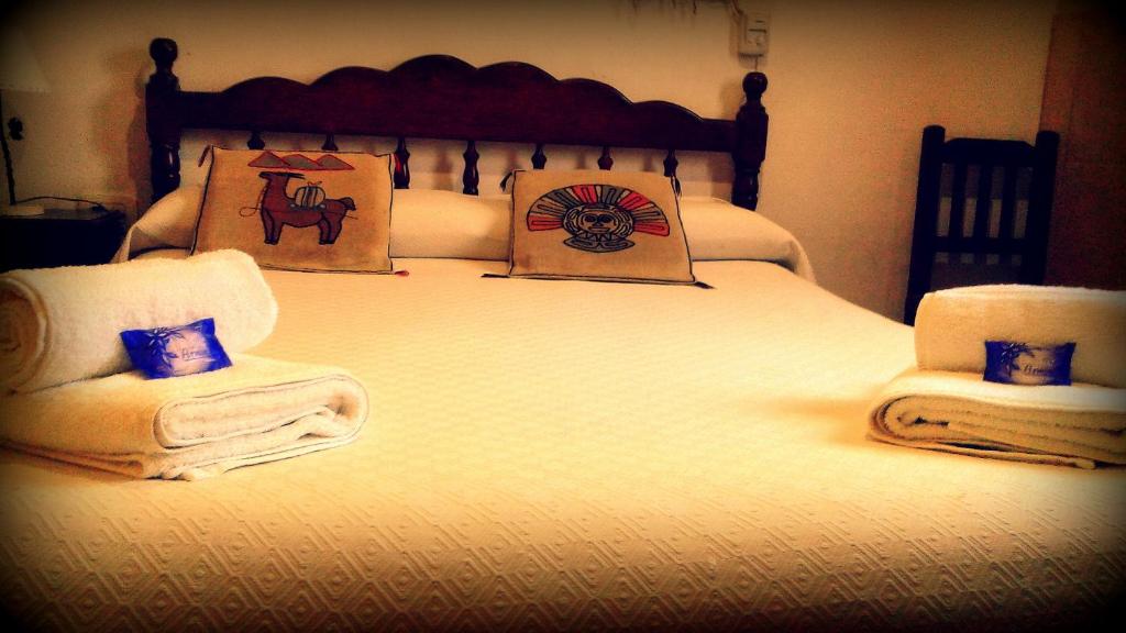 Posteľ alebo postele v izbe v ubytovaní Hostal Yatasto