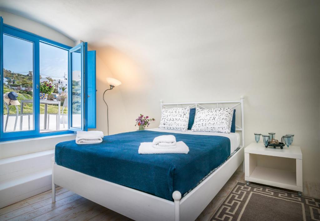 Postel nebo postele na pokoji v ubytování Fava Eco Suites