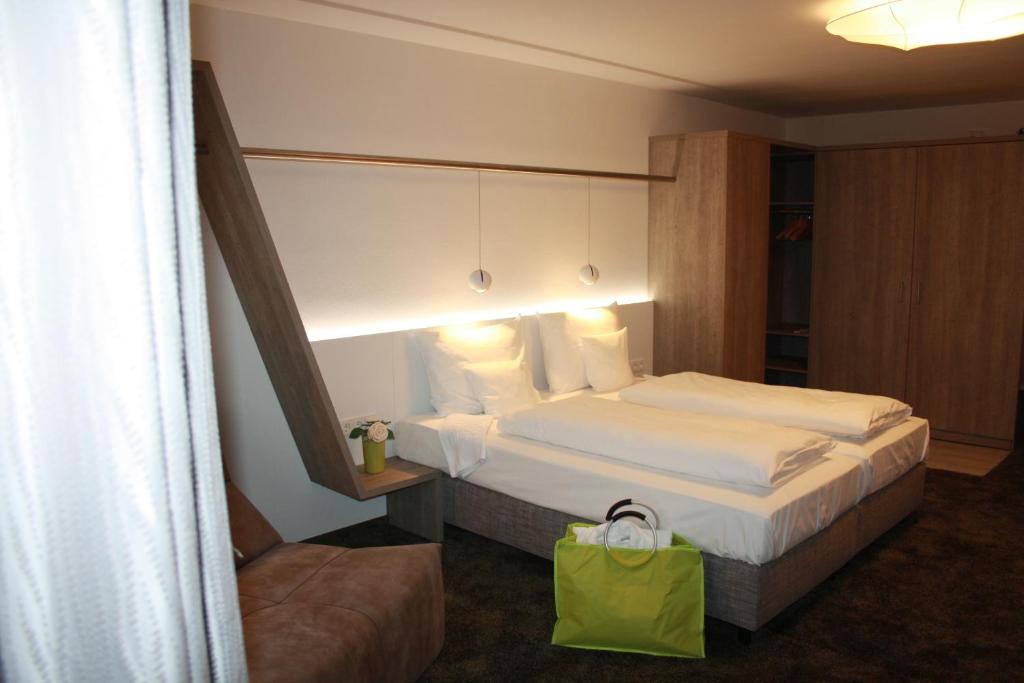 Postel nebo postele na pokoji v ubytování Boutique-Hotel im Weingarten