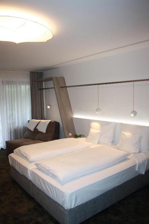 Postel nebo postele na pokoji v ubytování Boutique-Hotel im Weingarten