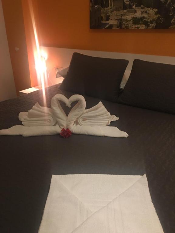 Letto o letti in una camera di amaranto bnb