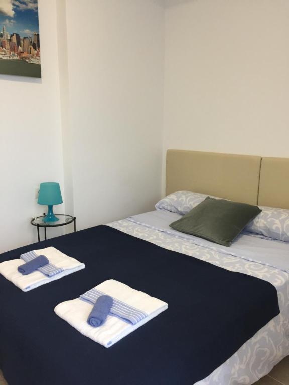 Posteľ alebo postele v izbe v ubytovaní Málaga Centro Hostel