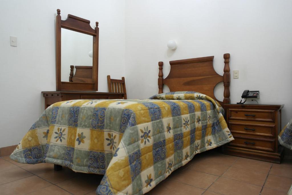 Postel nebo postele na pokoji v ubytování Hotel de los baños