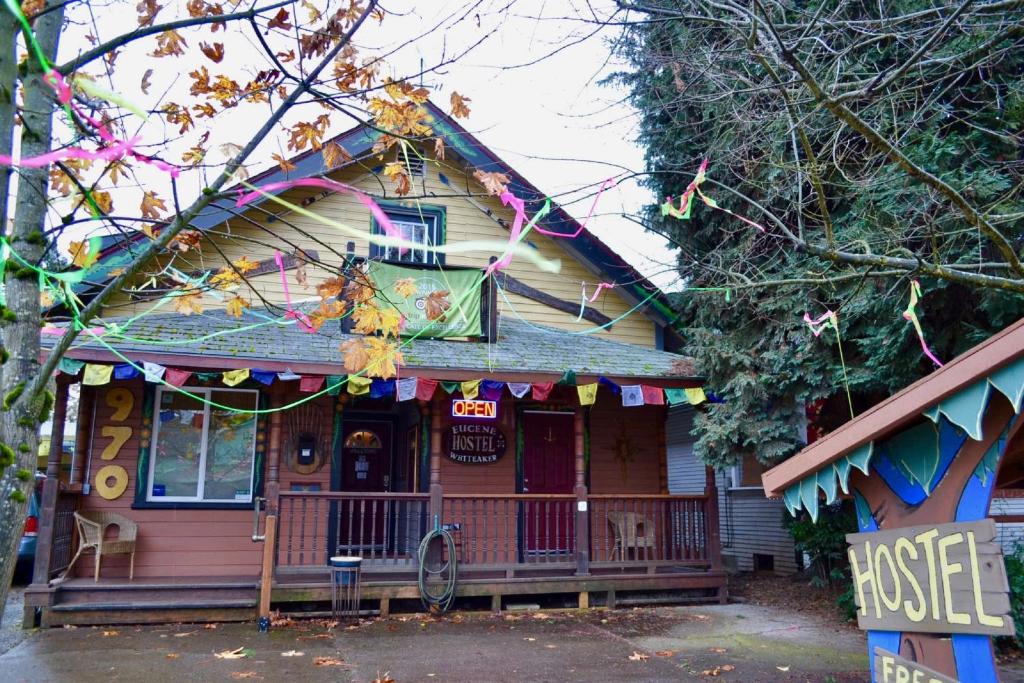 a house with a bunch of kites hanging from it at Eugene Lodge and International Hostel in Eugene