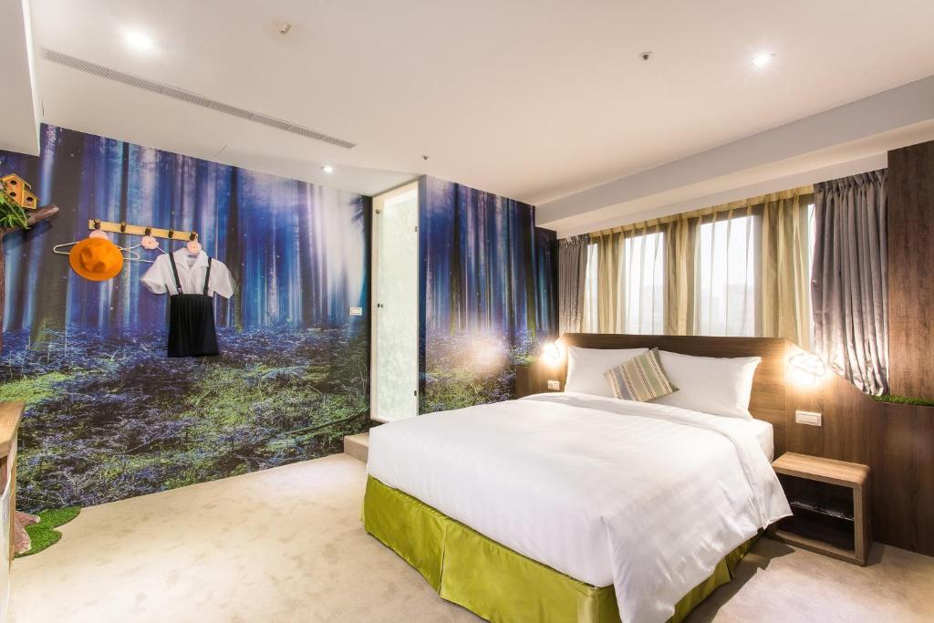 Postel nebo postele na pokoji v ubytování RF Hotel - Sanchong