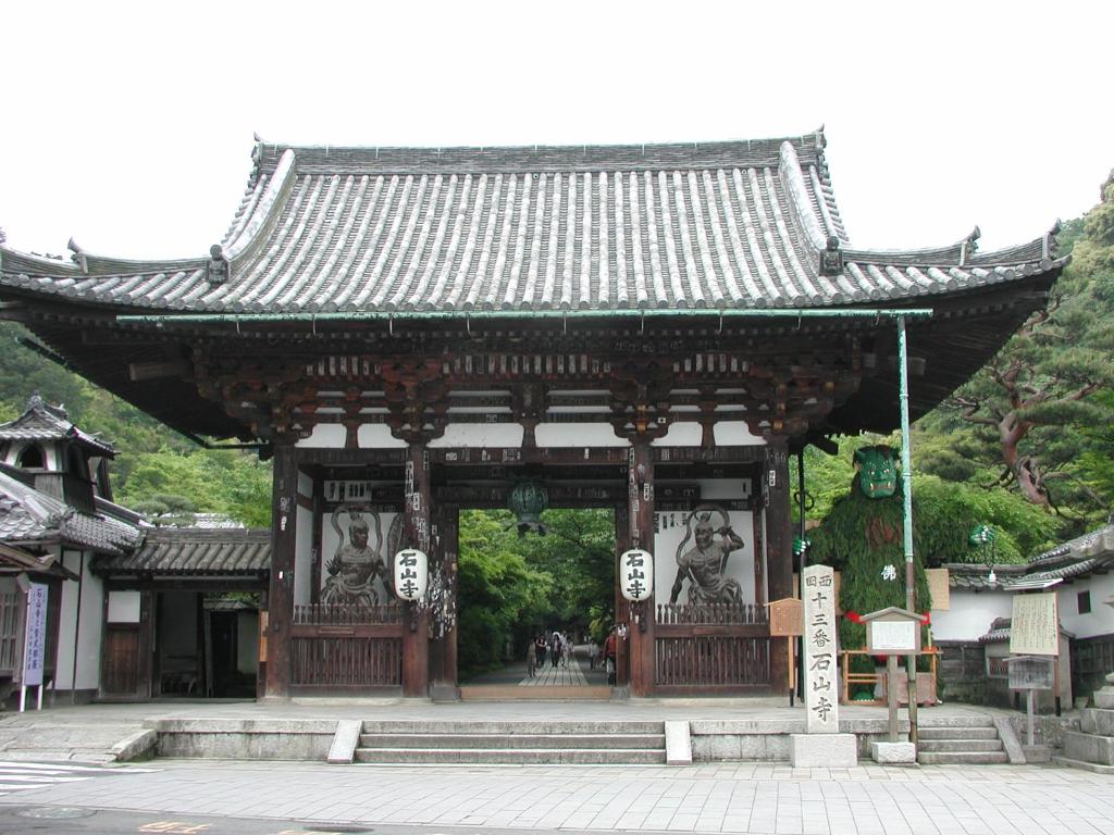 an asian temple with statues on the front of it at Lake Biwa Otsu Prince Hotel in Otsu