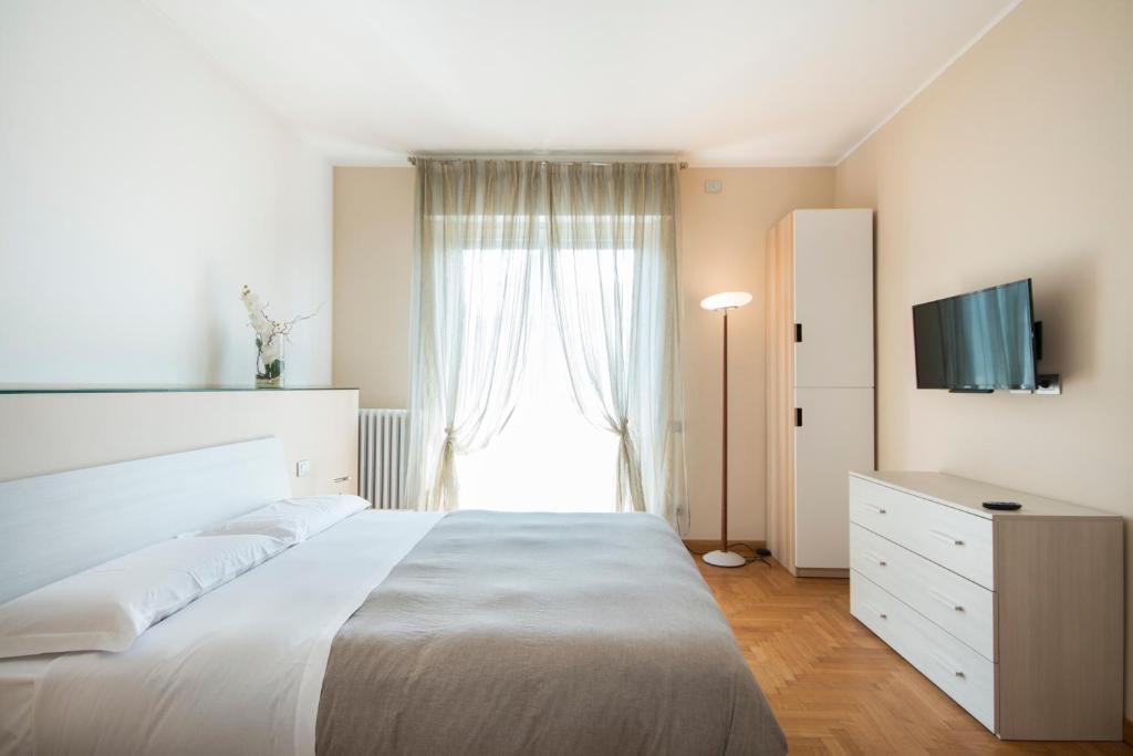 Postel nebo postele na pokoji v ubytování Casa Foscolo