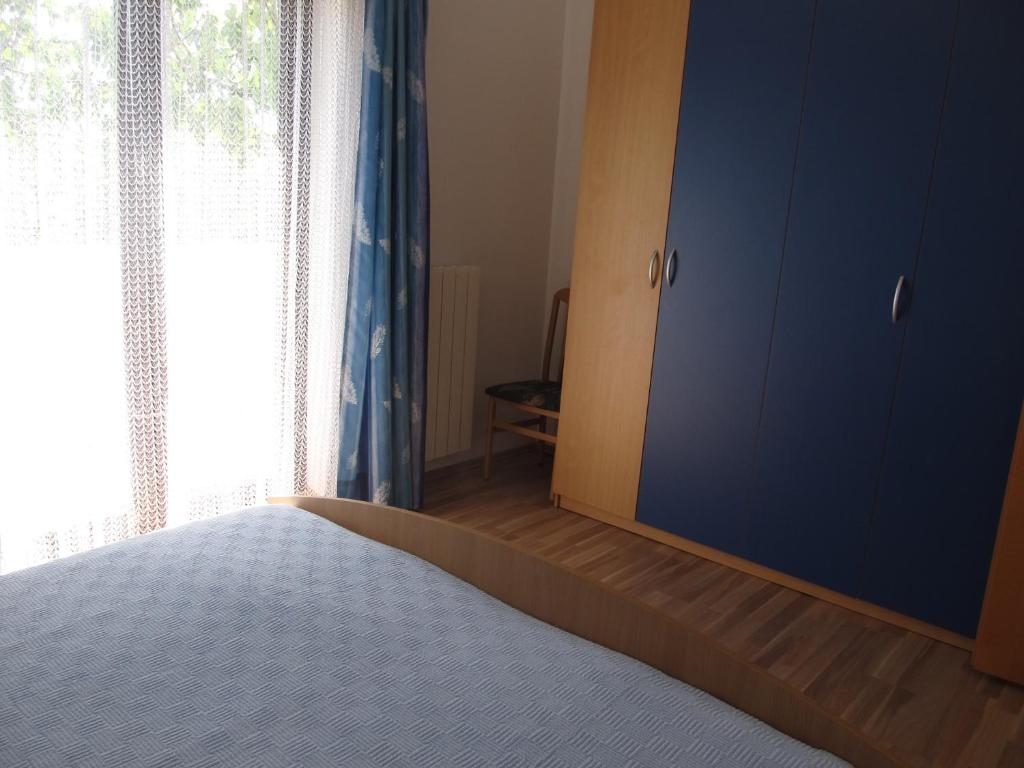 Postel nebo postele na pokoji v ubytování Apartment Stipo A5
