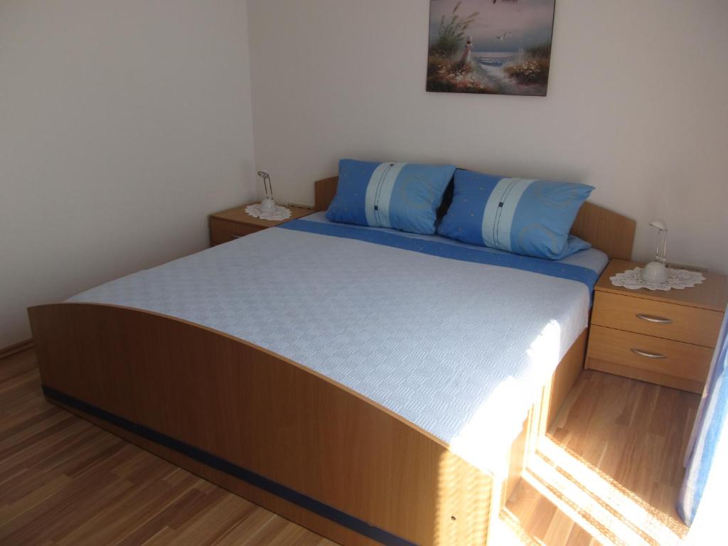 Postel nebo postele na pokoji v ubytování Apartment Stipo A5