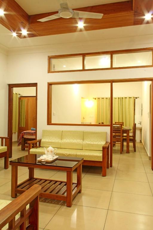 Χώρος καθιστικού στο Coorg Rahul Villa- 3 Deluxe Bedrooms