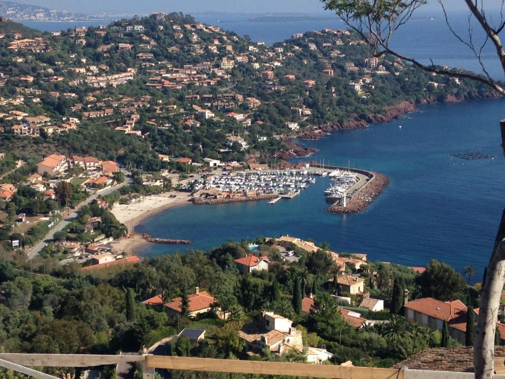 a view of a harbor with boats in the water at Plage de Miramar in Théoule-sur-Mer