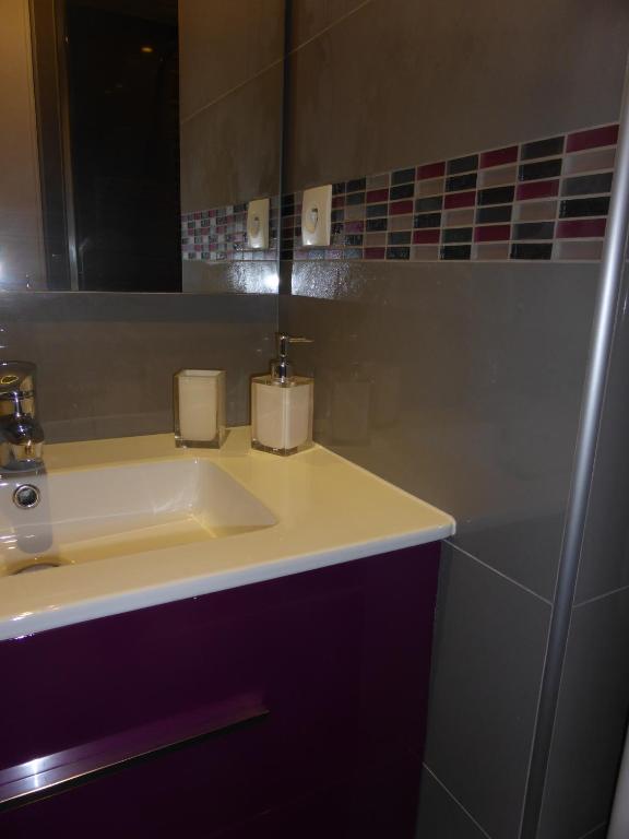 a bathroom with a sink and a mirror at Plage de Miramar in Théoule-sur-Mer