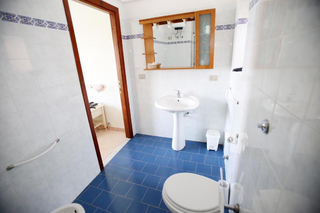 Koupelna v ubytování Hotel Paola
