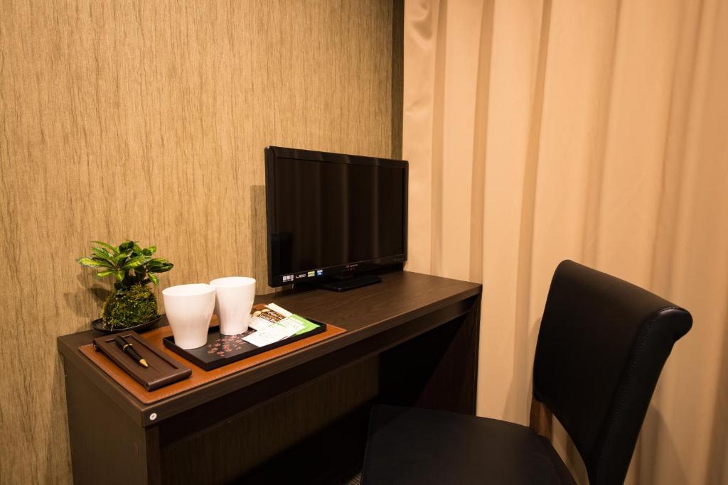 TV a/nebo společenská místnost v ubytování Hotel CoCoDe Plus