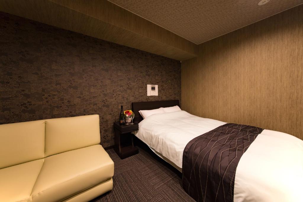 Postel nebo postele na pokoji v ubytování Hotel CoCoDe Plus