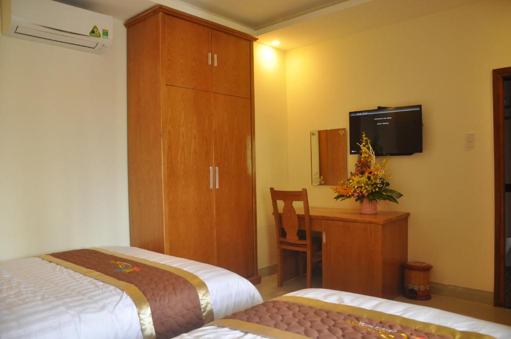 Postel nebo postele na pokoji v ubytování Charming Danang Hotel-203 Nguyễn Văn Thoại