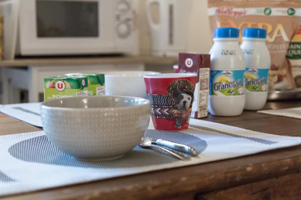 a kitchen counter with a bowl and other ingredients at Bed end breakfast du centre in Bourg-Saint-Maurice