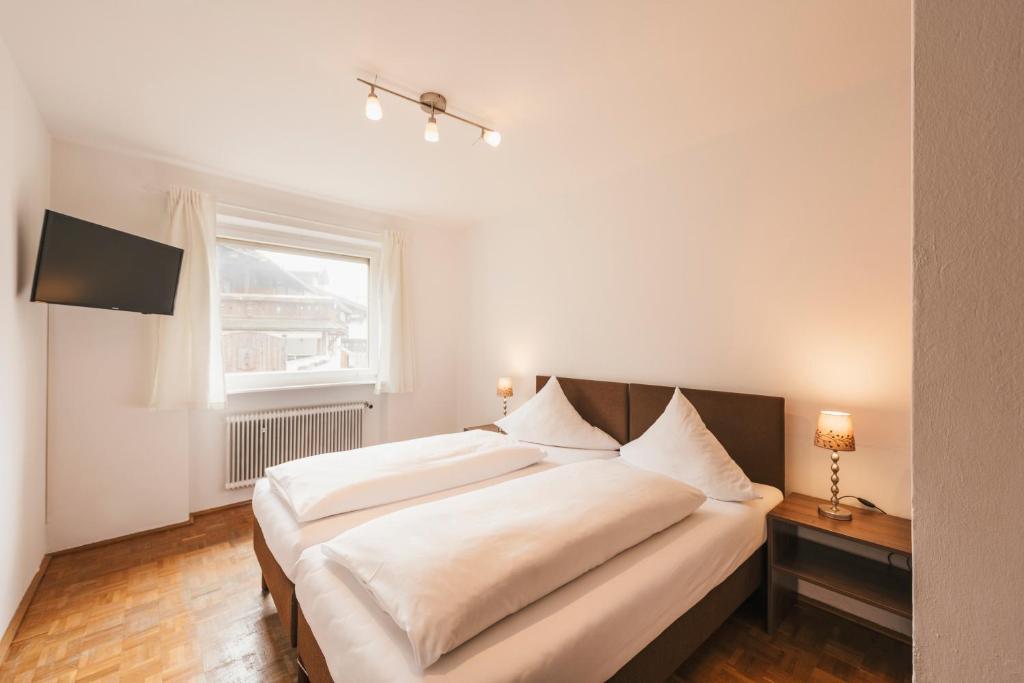 A bed or beds in a room at Ferienhaus Hoferwirt