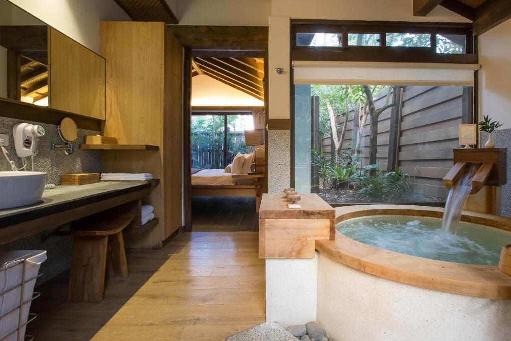 a bathroom with a jacuzzi tub in a kitchen at Mudanwan Villa in Mudan