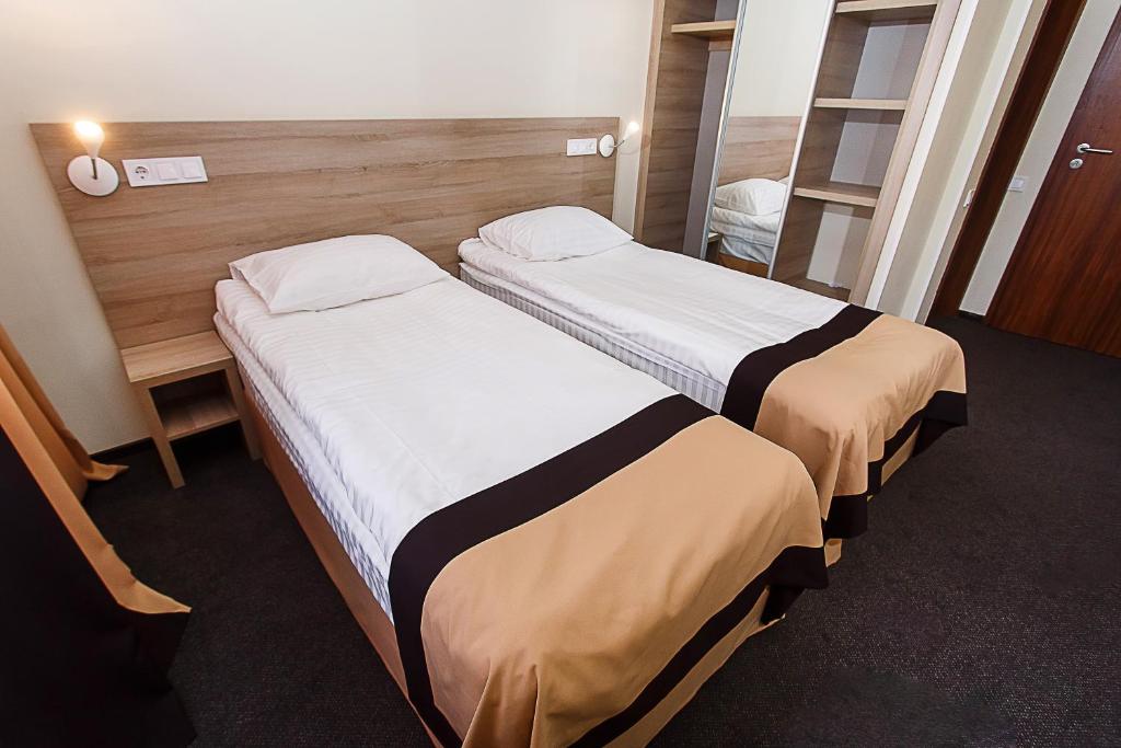 Postel nebo postele na pokoji v ubytování VitaPark Borysfen