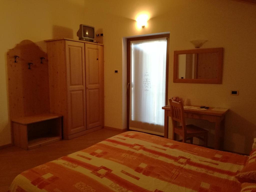Postel nebo postele na pokoji v ubytování Agriturismo Le Cavade