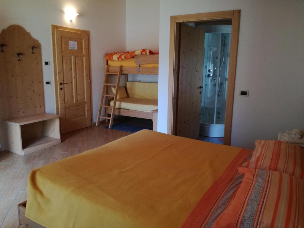 Postel nebo postele na pokoji v ubytování Agriturismo Le Cavade