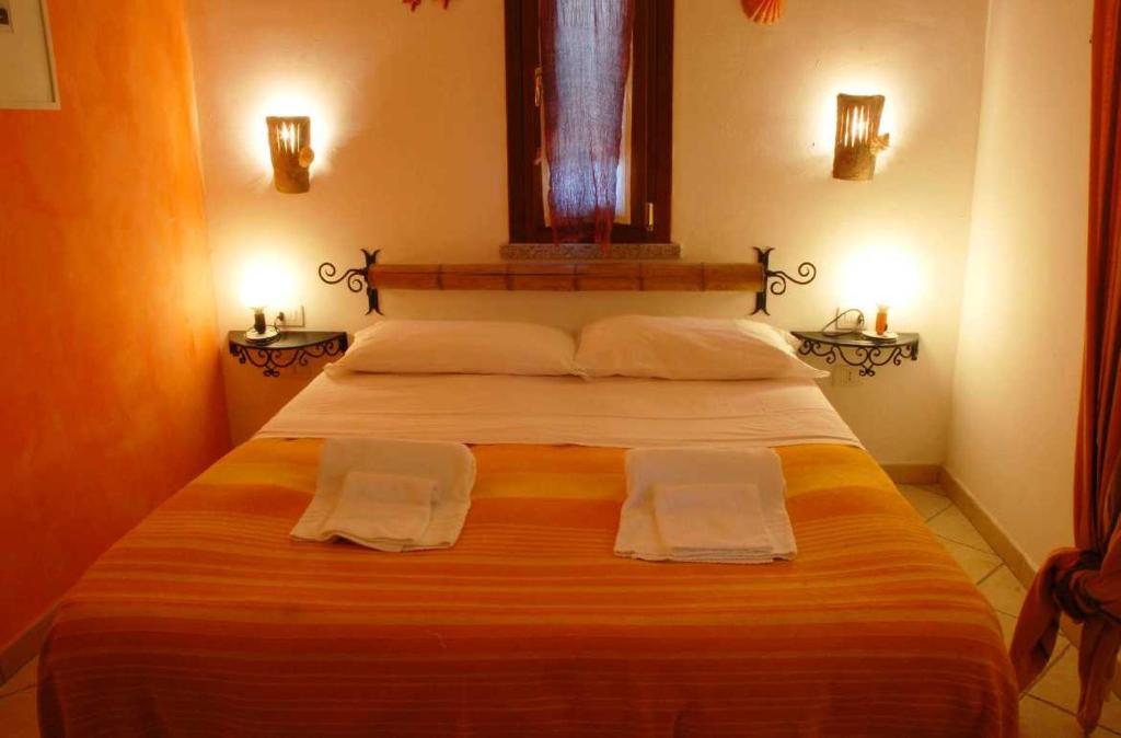 Postel nebo postele na pokoji v ubytování Li Espi Country Resort
