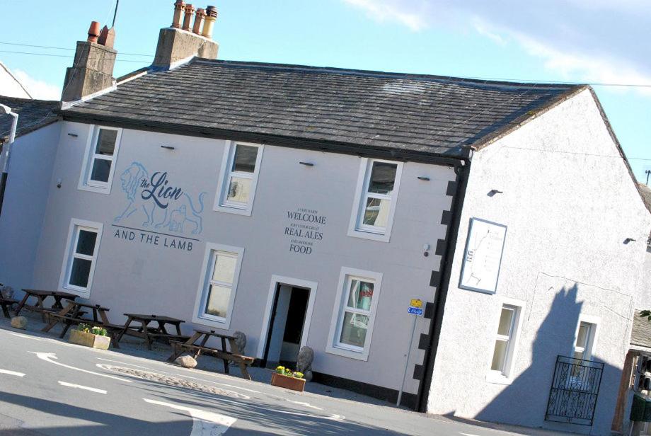 a white building on the side of a street at The Lion and The Lamb in Seascale