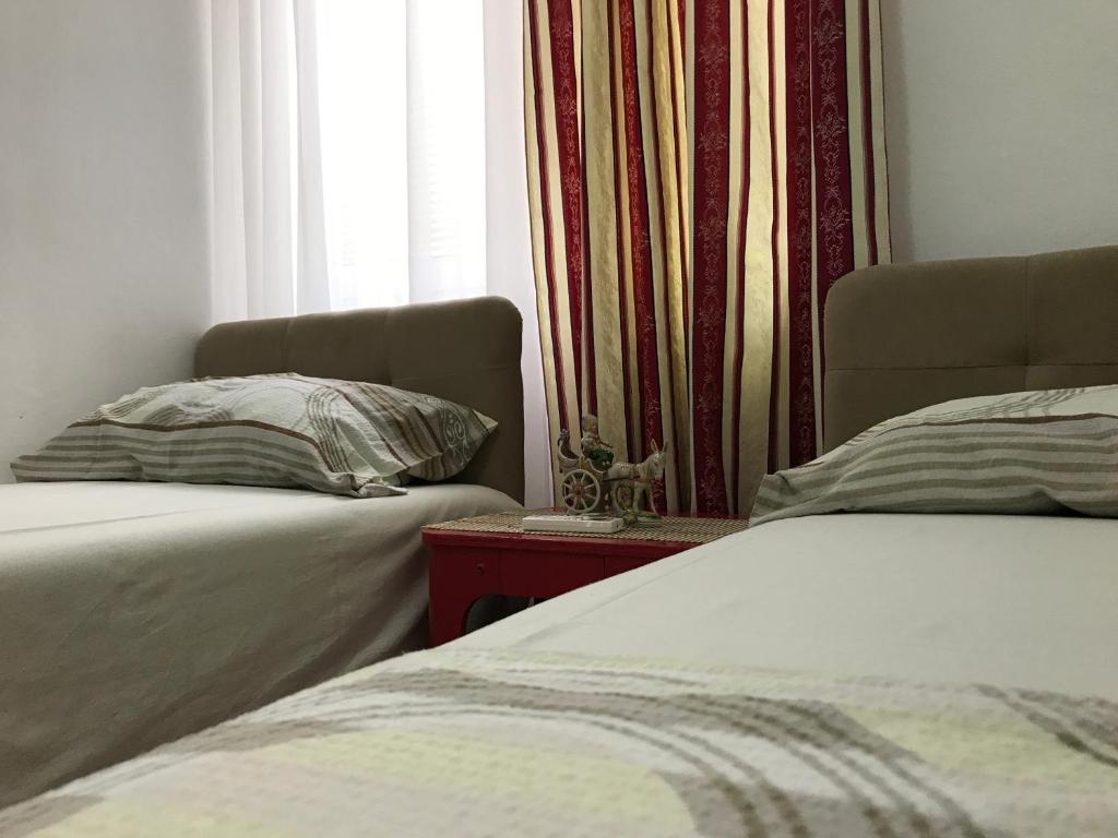 Postel nebo postele na pokoji v ubytování Apartments Pavićević