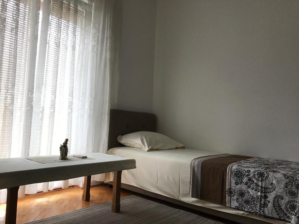 Postel nebo postele na pokoji v ubytování Apartments Pavićević