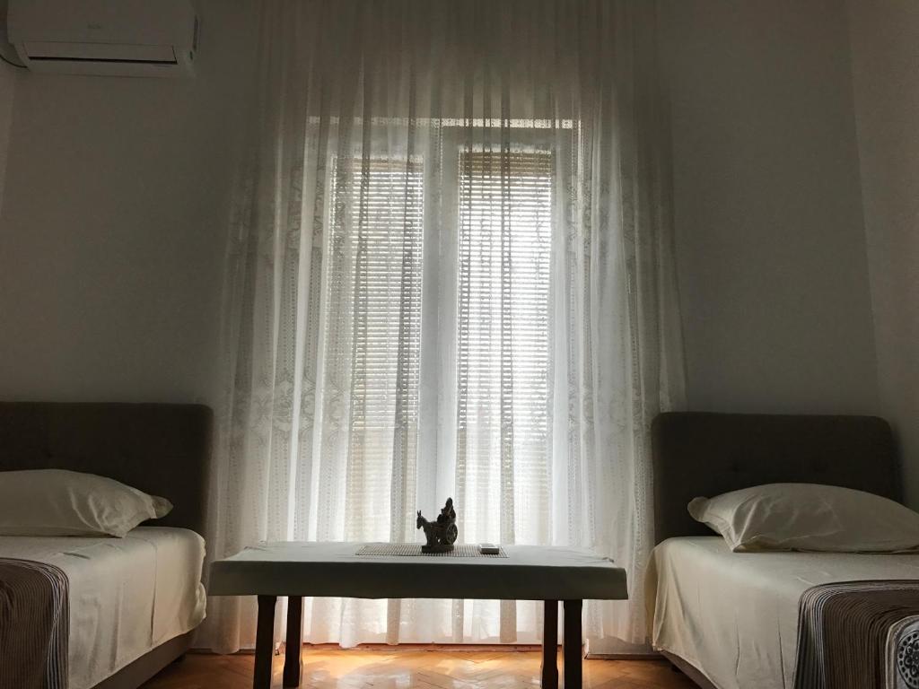 Postel nebo postele na pokoji v ubytování Apartments Pavićević