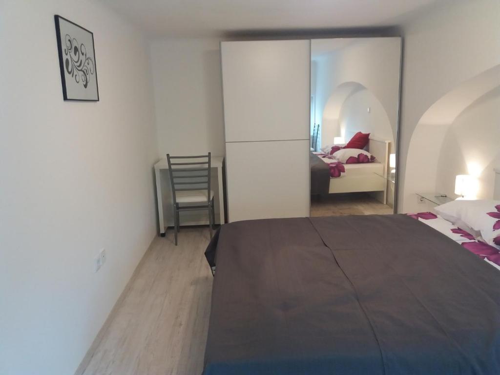 Posteľ alebo postele v izbe v ubytovaní Apartment Osk
