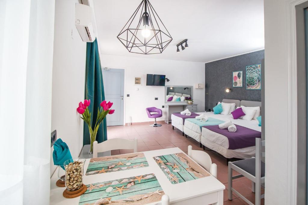 Postel nebo postele na pokoji v ubytování Kahlua Hotel Apartments