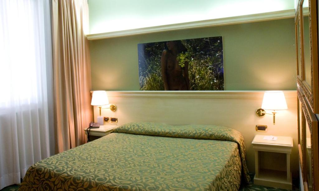 Postel nebo postele na pokoji v ubytování HM MotelHotel