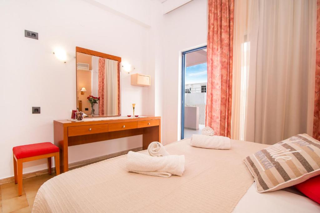 Postel nebo postele na pokoji v ubytování Kahlua Hotel Apartments