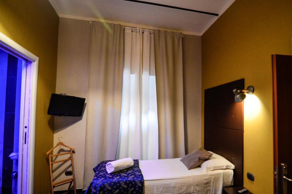 Postel nebo postele na pokoji v ubytování Hotel Felice