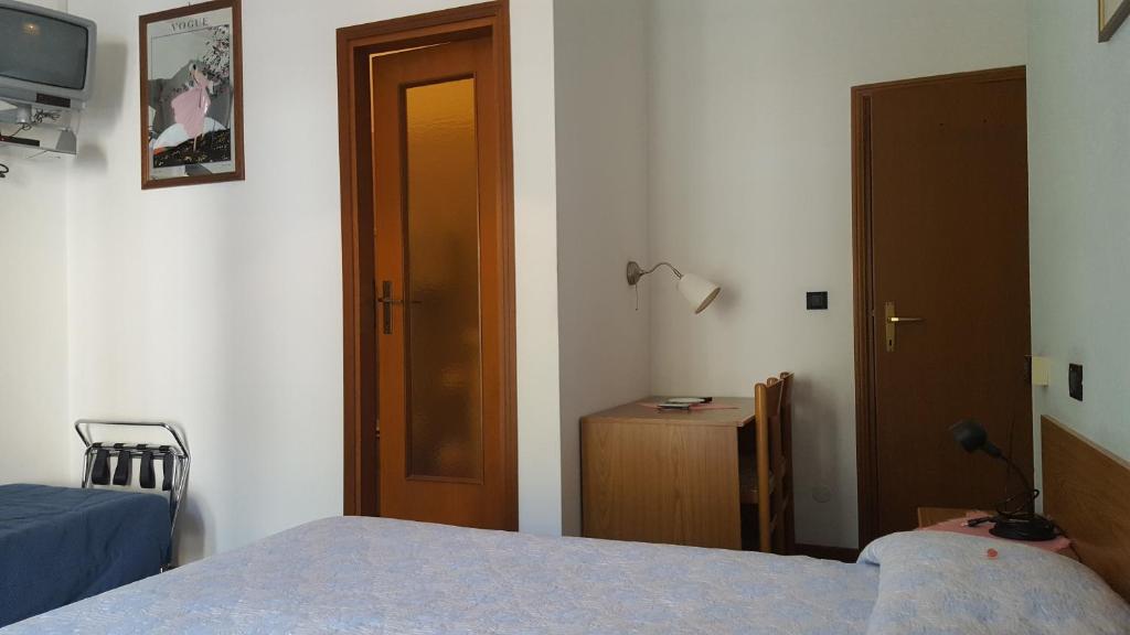 Postel nebo postele na pokoji v ubytování Hotel Firenze