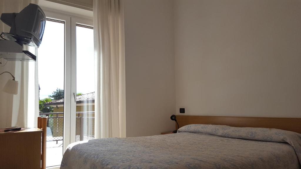 Postel nebo postele na pokoji v ubytování Hotel Firenze