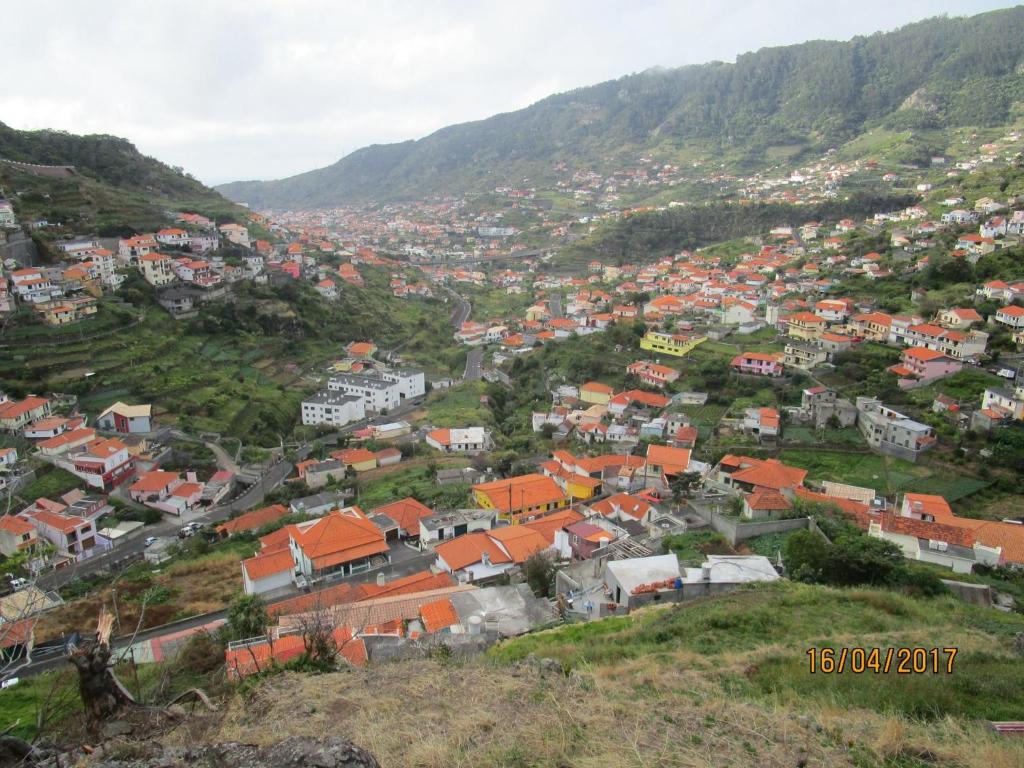 an aerial view of a town in the mountains at Marques House in Machico