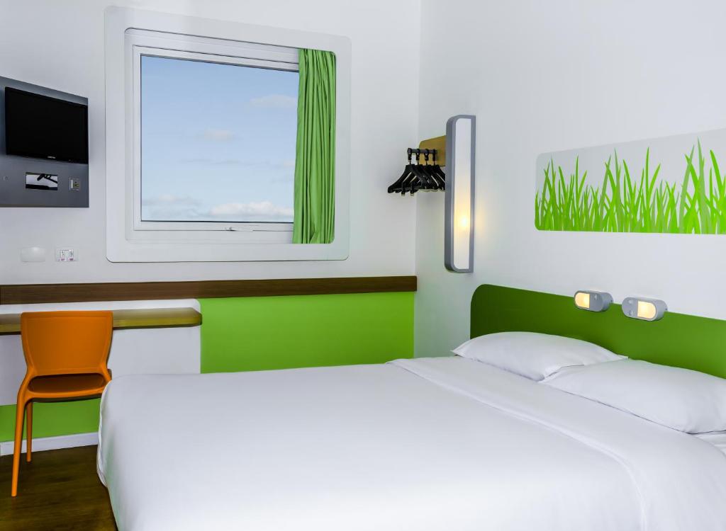 Postel nebo postele na pokoji v ubytování ibis budget Porto Alegre