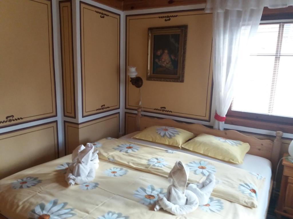 Postel nebo postele na pokoji v ubytování Guest House Bashtina Striaha