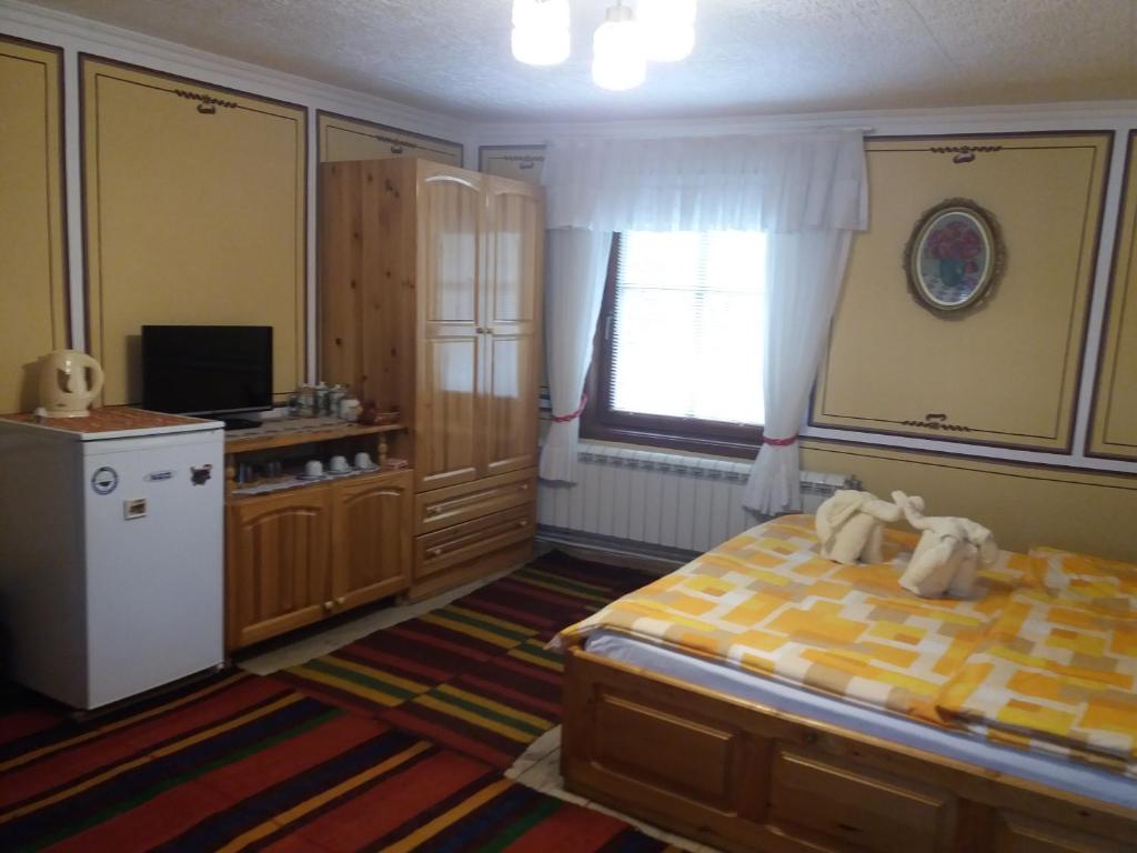 Postel nebo postele na pokoji v ubytování Guest House Bashtina Striaha