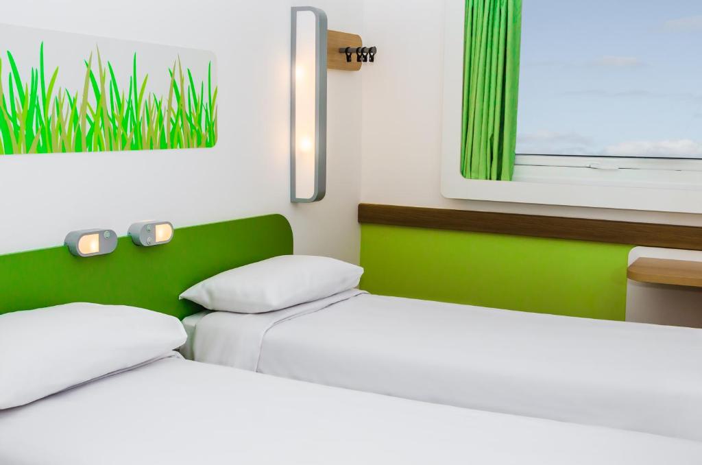 Postel nebo postele na pokoji v ubytování ibis budget Porto Alegre