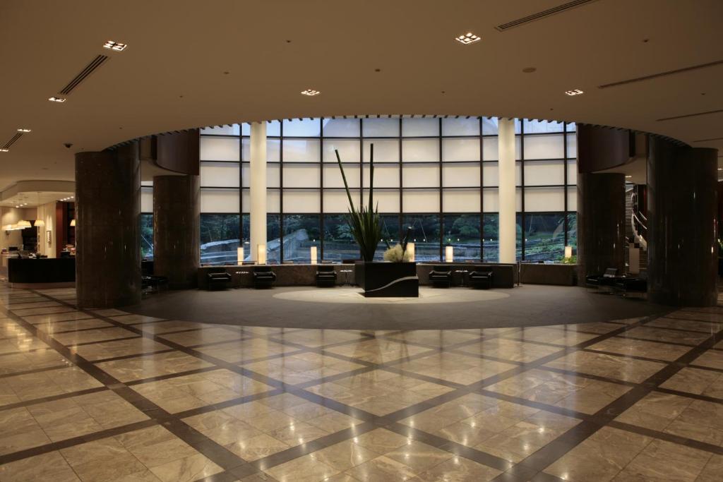 a large lobby with a large window in a building at Cerulean Tower Tokyu Hotel, A Pan Pacific Partner Hotel in Tokyo